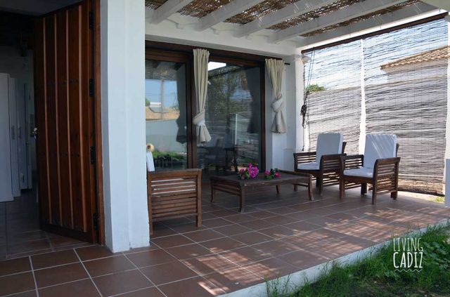 Terrace with table, sofas and chairs